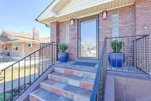 Property entrance with brick siding