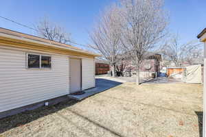 View of yard with a patio area and fence