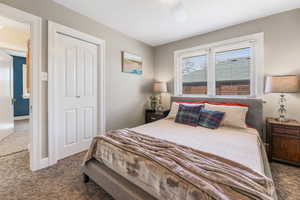 Bedroom with carpet and a ceiling fan