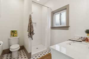 Brand new bathroom, new tiled shower and quartz top vanity, retro patterned tile.