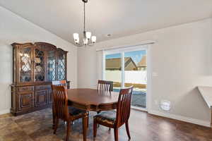 Dining room featuring visible vents, a notable chandelier, and baseboards