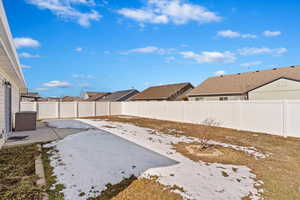 View of yard featuring a fenced backyard and a residential view