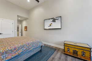 Bedroom featuring recessed lighting, visible vents, baseboards, and wood finished floors