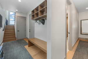 Mudroom with baseboards, recessed lighting, visible vents, and light wood-style floors