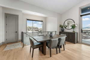 Dining space with light wood-type flooring and baseboards