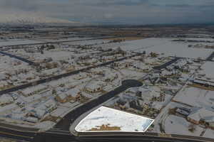 Snowy aerial view with a residential view