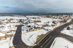 Snowy aerial view featuring a residential view