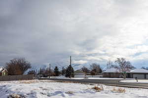 Snowy yard with fence