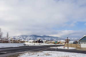 Property view of mountains with a residential view