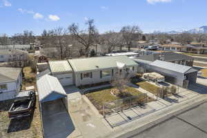 Birds eye view of property featuring a mountain view and a residential view