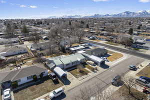 Drone / aerial view featuring a residential view and a mountain view