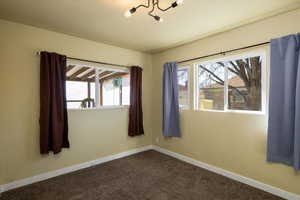 2nd bedroom to the right of the bathroom, lots of natural light with a window into the greenhouse.