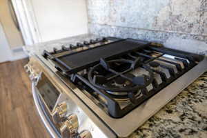 Interior details featuring dark wood-style floors and stovetop