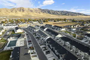 Birds eye view of property featuring a residential view and a mountain view