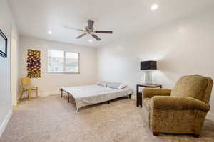 Bedroom featuring baseboards, ceiling fan, light colored carpet, and recessed lighting