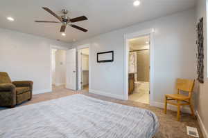 Bedroom featuring recessed lighting, visible vents, light colored carpet, a spacious closet, and baseboards