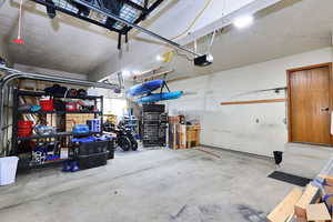 Garage featuring a garage door opener