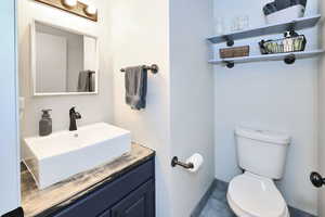 Bathroom with vanity and toilet