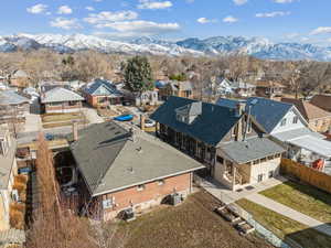 Aerial view featuring a mountain view and a residential view