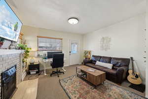 Living Room featuring a brick fireplace