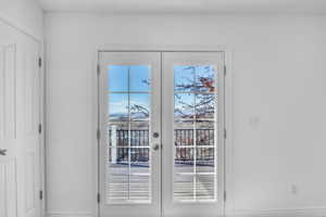 Entryway featuring a wealth of natural light and french doors