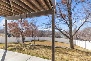 View of yard featuring a fenced backyard and a patio