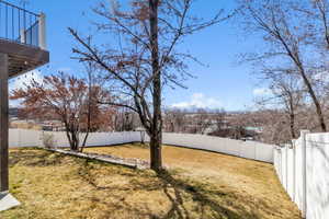 View of yard with a fenced backyard