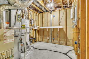 Utility room featuring water heater