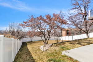 View of yard featuring a fenced backyard