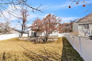 View of yard with a fenced backyard