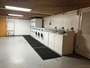 Community laundry room with stacked washer / dryer and washer and dryer