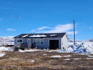 View of front of property featuring a mountain view