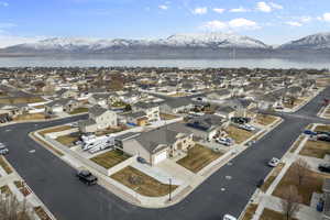 Aerial view featuring a residential view and a water and mountain view