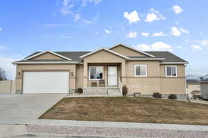 Single story home featuring a garage, roof with shingles, concrete driveway, and stucco siding