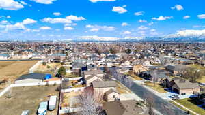 Birds eye view of property featuring a mountain view and a residential view