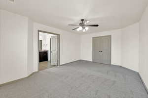 Unfurnished room featuring light carpet, visible vents, and baseboards