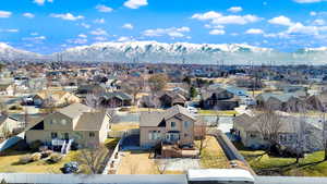 Drone / aerial view featuring a residential view and a mountain view