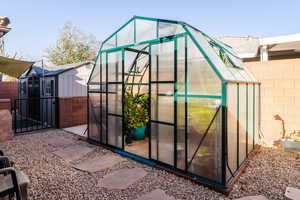 View of greenhouse with fence