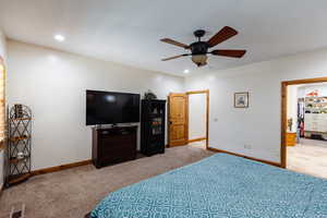 Carpeted bedroom featuring recessed lighting, visible vents, and baseboards