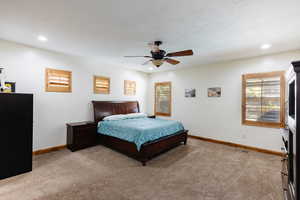 Bedroom featuring recessed lighting, carpet flooring, visible vents, and baseboards