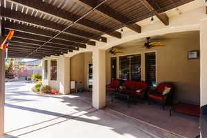 View of patio featuring outdoor lounge area and a ceiling fan