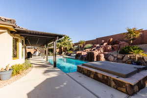 View of swimming pool featuring a fenced in pool, a patio area, and a fenced backyard