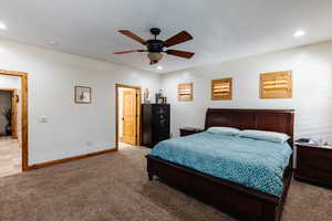 Bedroom with recessed lighting, carpet, a ceiling fan, and baseboards