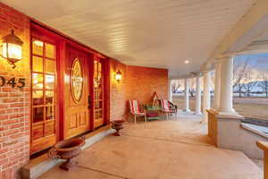 Property entrance with covered porch