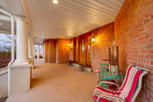 View of patio with a porch