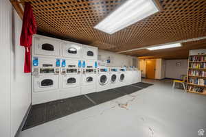 Shared laundry area featuring washer and dryer and stacked washer / dryer