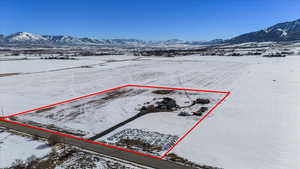 Snowy aerial view with a mountain view