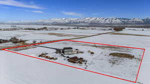 Snowy aerial view with a mountain view