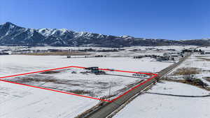 Snowy aerial view featuring a mountain view