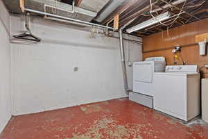 Unfinished basement with separate washer and dryer